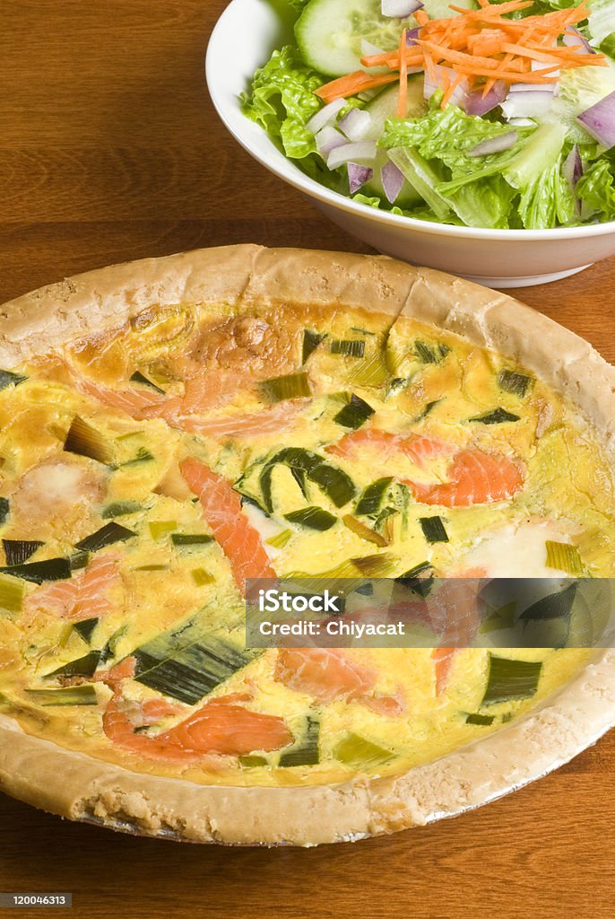 Smoked Salmon Quiche and Salad Smoked salmon quiche with leek, and fresh green salad. Baked Pastry Item Stock Photo