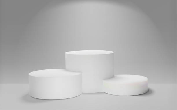 istock White winners podium 3D render. Awarding of winners of sports competitions. Round realistic pedestal. Vector illustration 1200464569