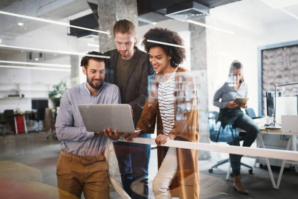 istock Business people, architects having discussion and working in office 1200464999