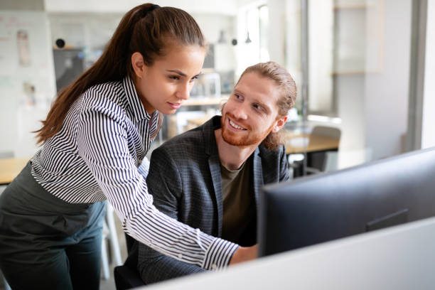 istock Business people having fun and chatting at workplace office 1200465757
