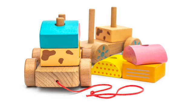 Stacking wooden toy train for little children on white background.