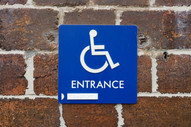 istock Wheelchair access sign with Braille. 1200466796