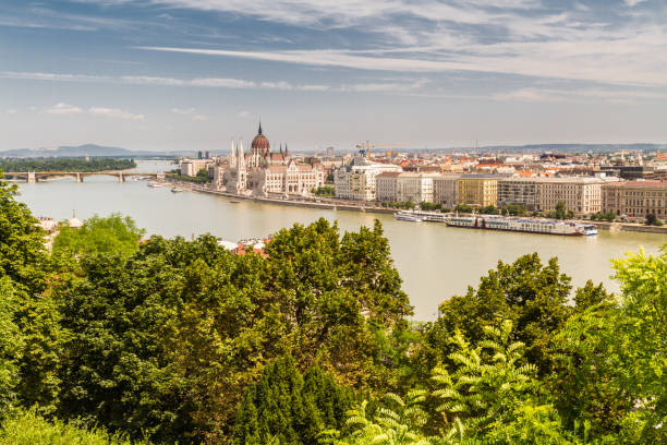 istock River Danube in Budapest Hungary, parliament building and trees. 1200468402