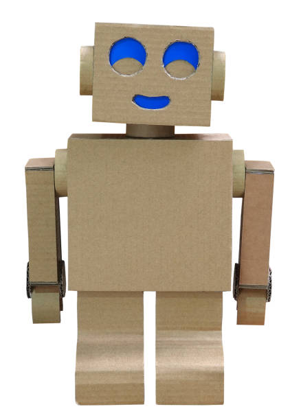 Robot homemade craft toy made of cardboard isolated on white background stock photo