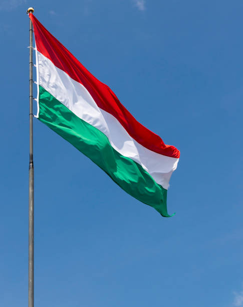 istock Hungarian flag on blue sky 1200470975