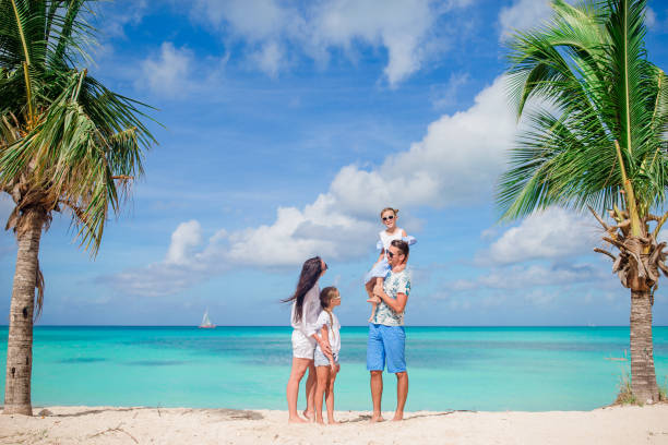 istock Happy family on the beach during summer vacation 1200471102