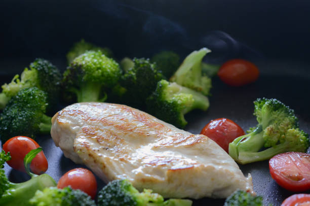 close up grilled chicken in different vegetables