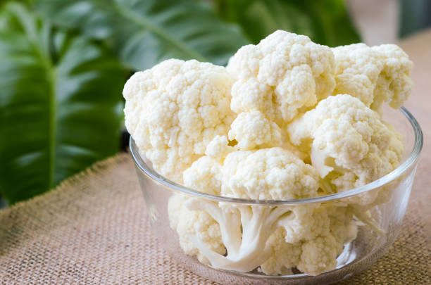 istock Fresh cauliflower in bowl on febric background. 1200475187