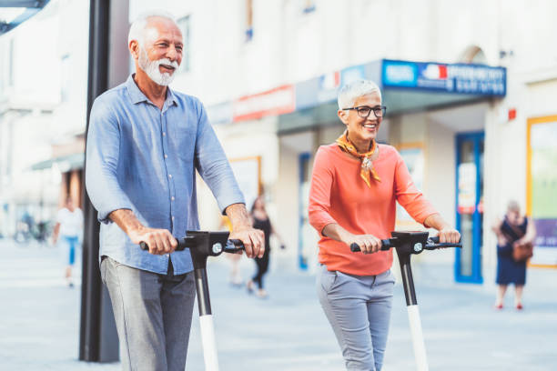 istock Modern senior couple with electric scooter 1200475235