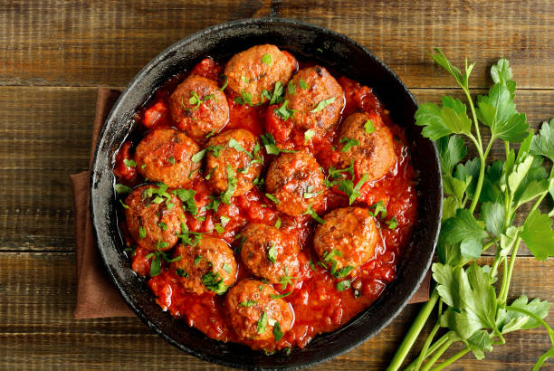 istock Meatballs with tomato sauce in frying pan 1200475814