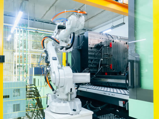 istock Smart factory industry 4.0 concept from robotic arm machine tool for production line of injection molding process at vehicle industrial factory. 1200477109