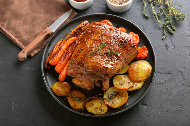 istock Bbq meat. Grilled pork, fried potatoes and carrots 1200480452