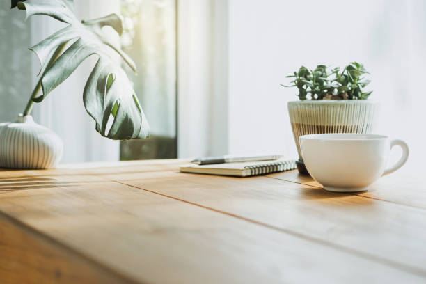 Interior and Decoration Closeup white cup of coffee with small trees and green leaf in vase on wooden table craft product photos stock pictures, royalty-free photos & images