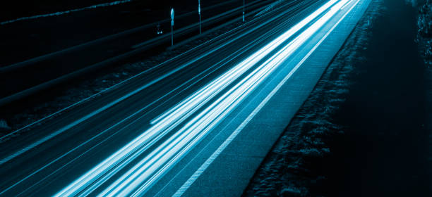 istock lights of cars with night 1200482777