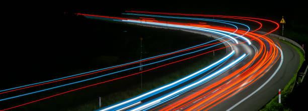 istock lights of cars with night 1200482804