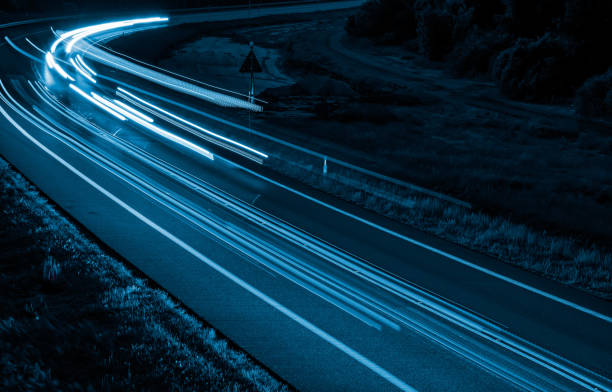 istock lights of cars with night 1200482840