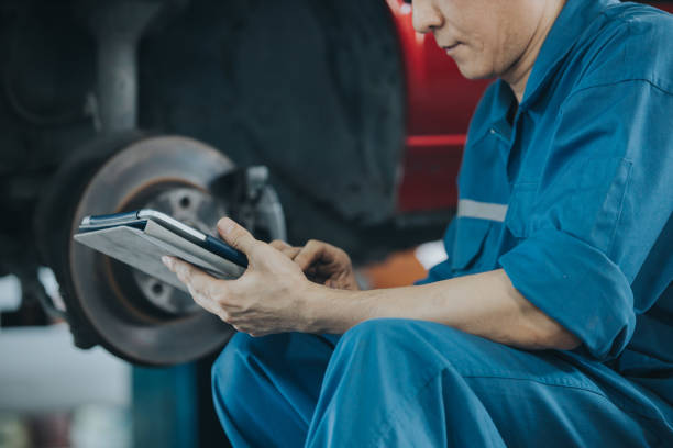 istock Thai mechanic men using digital tablet for working at his company 1200483075