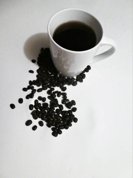 Cup of Coffee With Coffee Beans on White Background Vertical