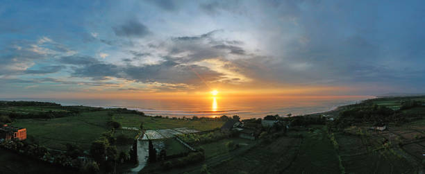 Aerial panorama from the west coast of Bali in Indonesia at sunset Aerial panorama from the west coast of Bali in Indonesia at sunset tanah lot sunset stock pictures, royalty-free photos & images