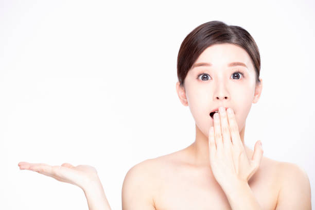 istock young beauty showing empty copy space on the open hand  palm 1200484625