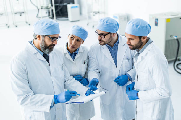 istock Team of scientists examining research data in laboratory. 1200485898