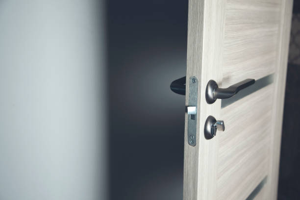 istock room opening wooden door on gray backgrond 1200486811