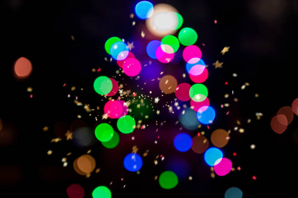 istock Abstract christmas tree with confetti stars on dark background. 1200492354