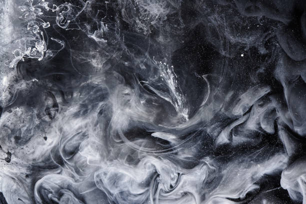 istock Abstract black and white swirling smoke background. Cumulus thunderclouds, mysterious and frightening sky. Paints colors of depression and negative emotions 1200492566