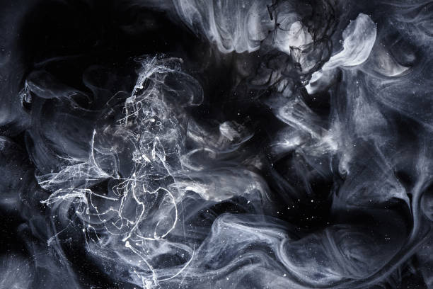 istock Abstract black and white swirling smoke background. Cumulus thunderclouds, mysterious and frightening sky. Paints colors of depression and negative emotions 1200492627