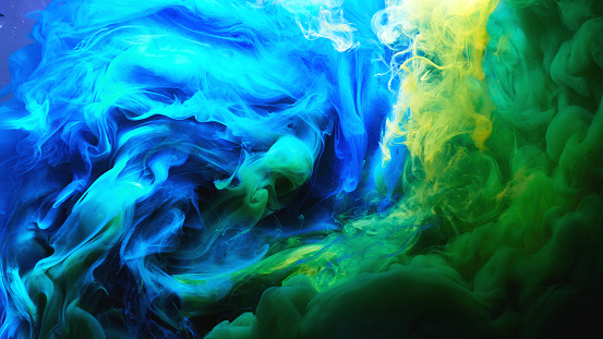 Abstract Dancing Colorful Fume Background Clouds Of Smoke Blue Green And  Yellow A Whirlwind Of Paints Stock Photo - Download Image Now - iStock