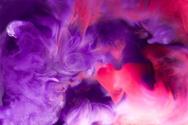istock Abstract multicolored swirling fume background. Pink, purple and blue hookah smoke backdrop 1200492749