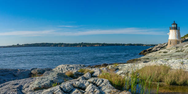 Castle Hill Lighthouse is located on Narragansett Bay in Newport, Rhode Island at the end of the historic Ocean Drive.