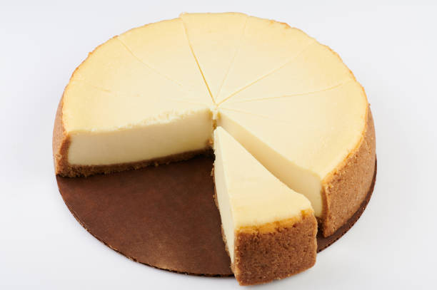 istock Taking out piece of cheesecake 1200495674