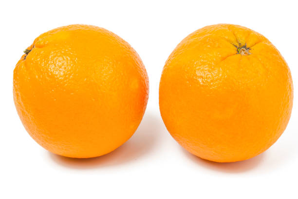 istock Fresh ripe oranges with useful vitamins isolated on white background. 1200497227