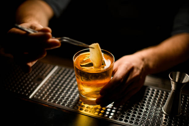 istock Darkened shot of bartender cooking alcohol drink 1200498069