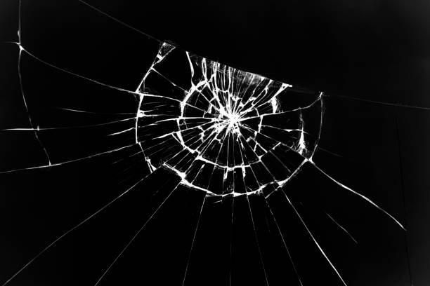 istock The texture of broken glass with cracks. Cracks on smartphone screen from impact. Concept for design. 1200498385