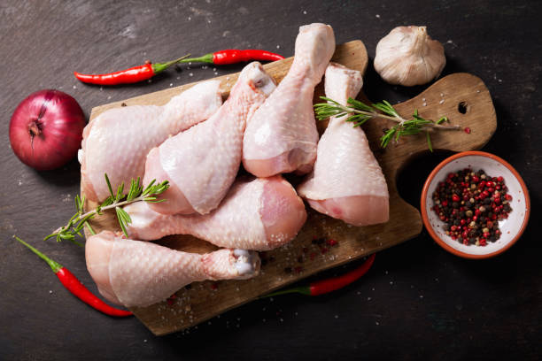 istock fresh chicken meat with rosemary and spices, top view 1200498579