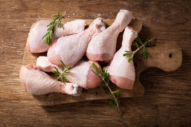 istock fresh chicken meat with rosemary and spices, top view 1200498584