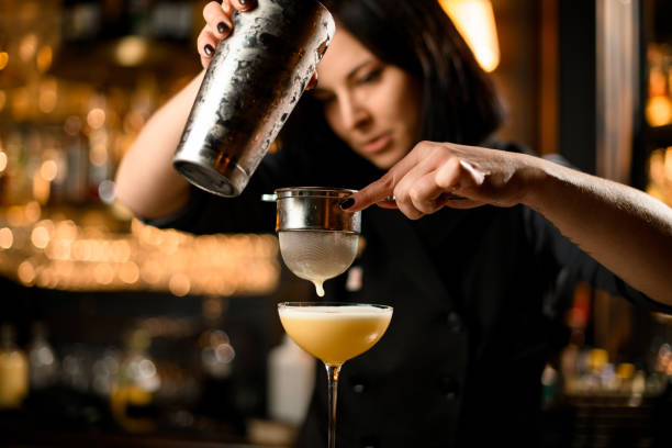 istock Bartender prepares cocktail drink with a sieve 1200498613