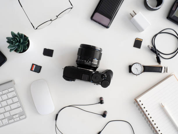 istock top view of office desk table with coffee cup and notebook on white background, graphic designer, Creative Designer concept. 1200499354