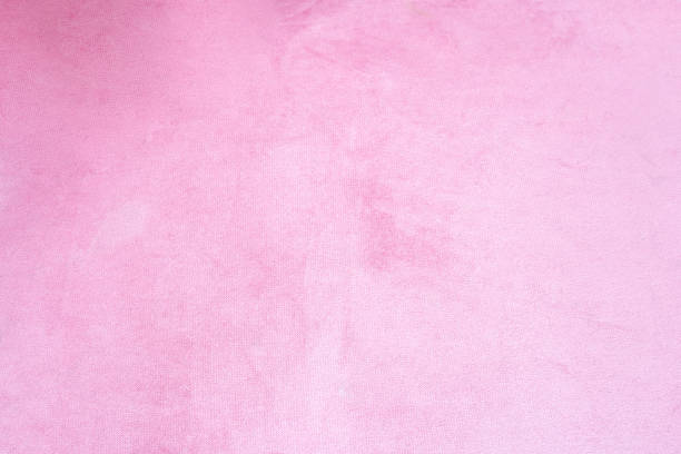 Close up of pink velvet fabric background texture, soft pastel pink textile stock photo