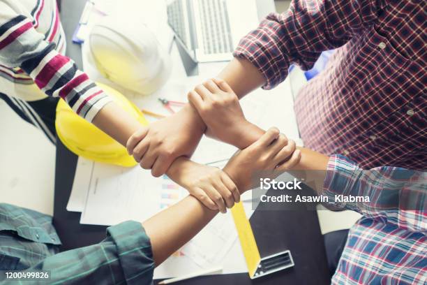 Stack Hands Of Business Engineering Teamwork Join Togetherconstruction Engineer Working In Construction Site Construction Engineer Conceptualarchitect Drawing On Architectural Project On Background Stock Photo - Download Image Now