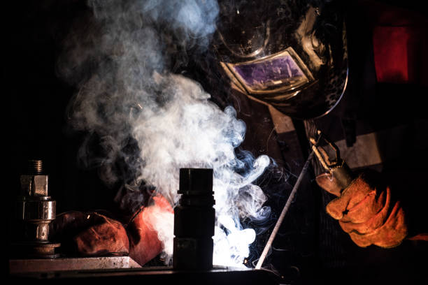 istock worker welds metal structures by electric arc welding 1200500606