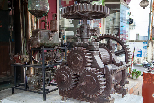 Phuket, Thailand- December 11, 2019: Old rusty engine in phuket old town, store design element