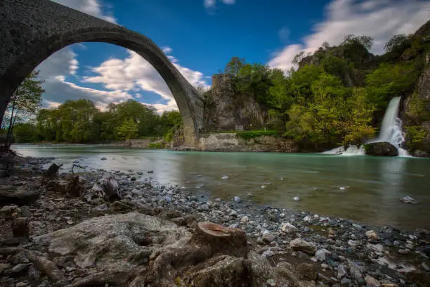 The famous old stoned bridge of Konitsa over Aoos river. Tymfi mount, Zagori, Epirus, Greece, Europe