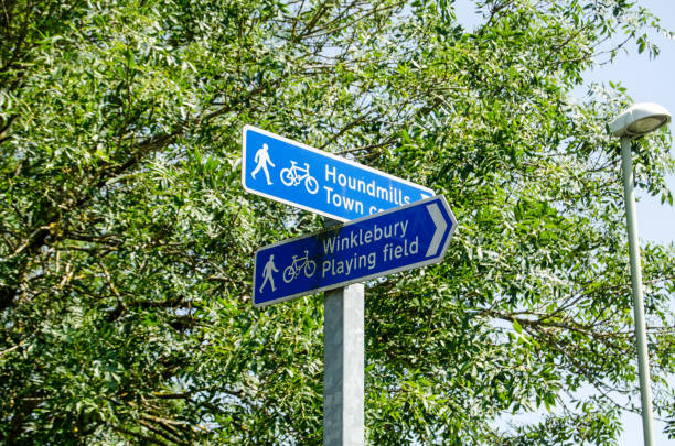 Footpath signs, Basingstoke Fingerpost direction signs for pedestrians and cyclists in Basingstoke, Hampshire. Sunny summer day. basingstoke photos stock pictures, royalty-free photos & images