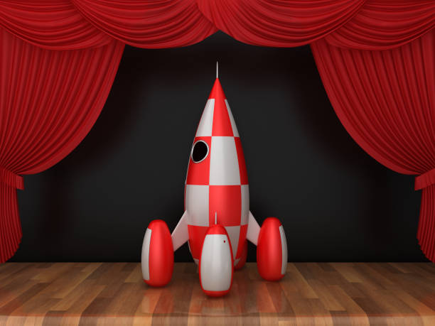 istock Red Stage Curtains with Rocket on Wood Floor - 3D Rendering 1200508458