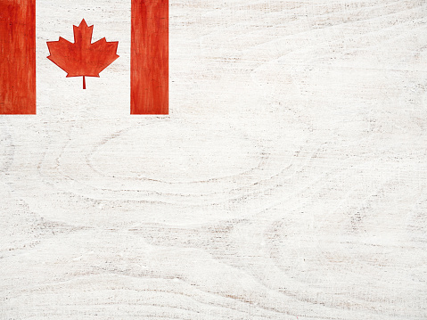 Beautiful drawing of the Canadian Flag. White isolated background, close-up, view from above. Congratulations for relatives, friends and colleagues