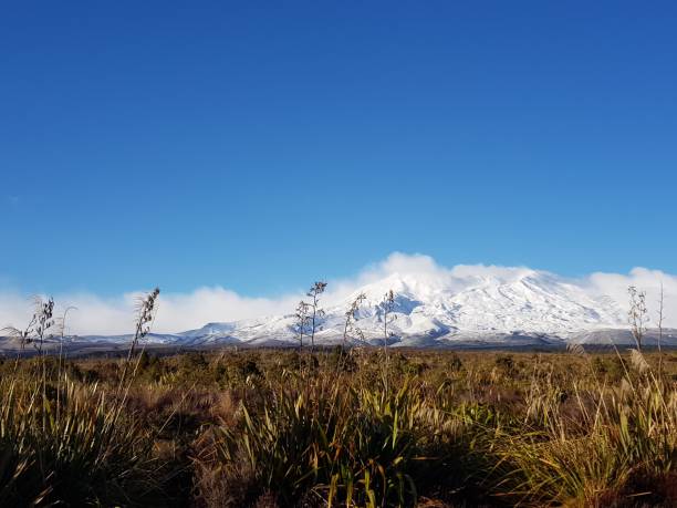 istock Beautiful snowy mountain by the countryside 1200512751