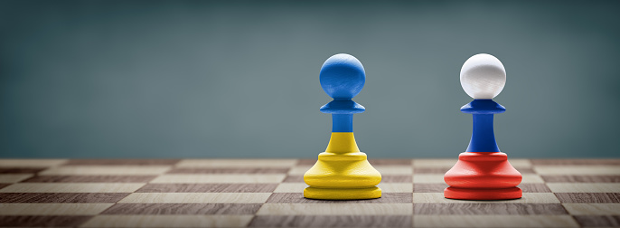 Ukraine and Russia conflict. Country flags on chess pawns on a chess board. 3D illustration.